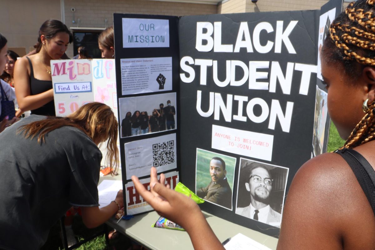 Journi Jones (11), president of the Black Student Union, explains the significance of her club. BSUs have been formed internationally as a means to support black student demographics.
