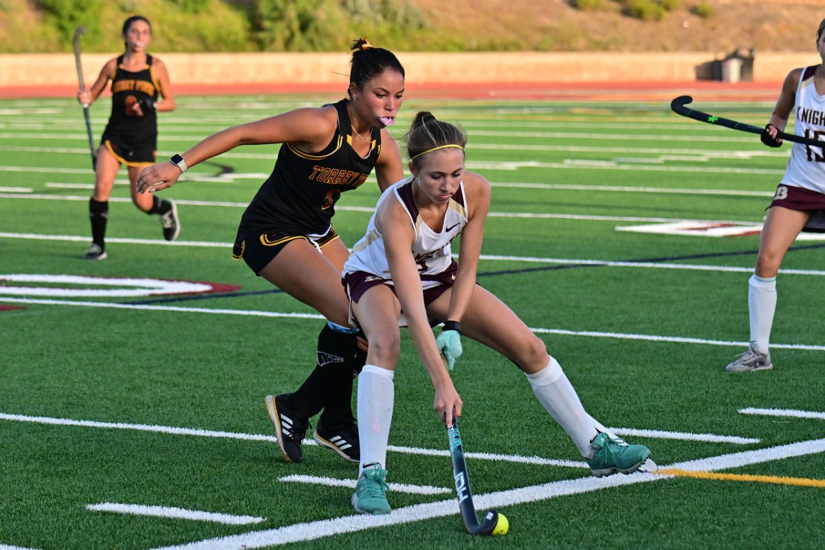 Ava Hauer (11) defends an opposing athlete in a home match vs. Bishops High School on Sept. 2, 2025. Hauer has been a key player on the varsity field hockey team for three consecutive years. Photo courtesy of Anna Scipione.