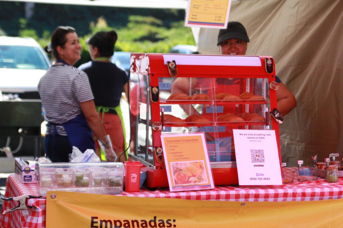 The five co-founders of Cali Empanadas make food and manage the stand. Originally from Los Angeles, Calo Empanadas has brought in many local and hungry costumers.