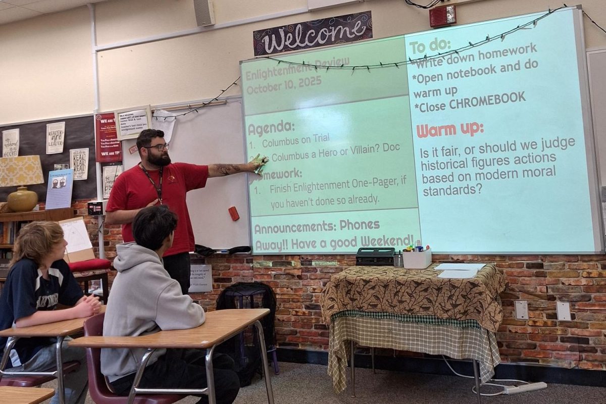 World History and SEI U.S. History teacher Ruben Martinez explains the class agenda. Martinez's lesson centered around Christopher Columbus, in recognition of the upcoming federal holiday on Monday. Photo courtesy of Ruben Martinez.