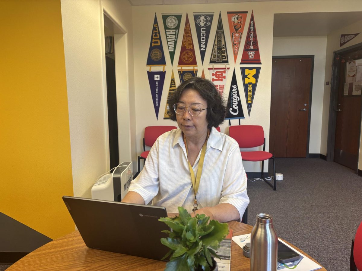 Estelle Chen, the school's college counselor, works in her office. Chen prepared for a meeting with American University.
