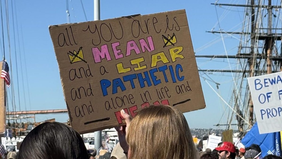 Protestors march down to the Downtown San Diego Harbor. Many held signs, such as lyrics from Taylor Swift's song, “Mean.”