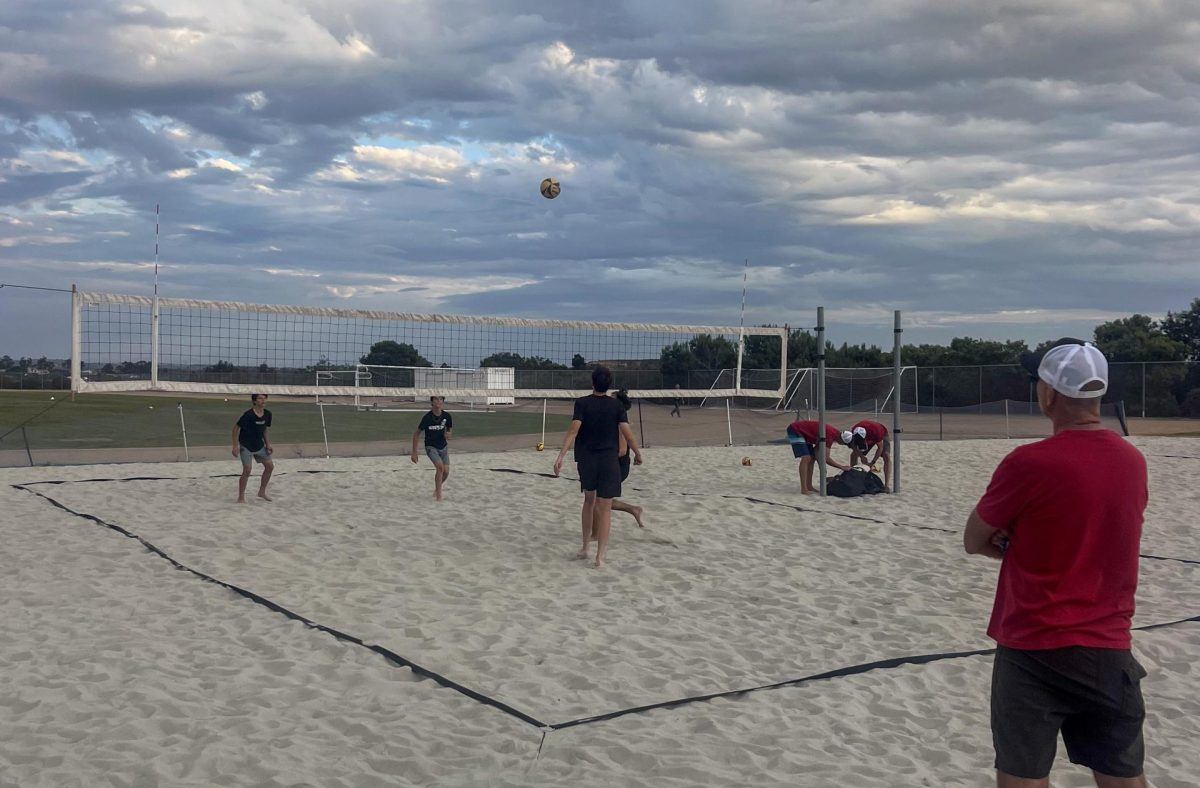 Chris Rosskopf, varsity head coach, looks at players as they play against Westview opponents. The Falcons defeated the Wolverines 4-1 in the game on Oct. 9.