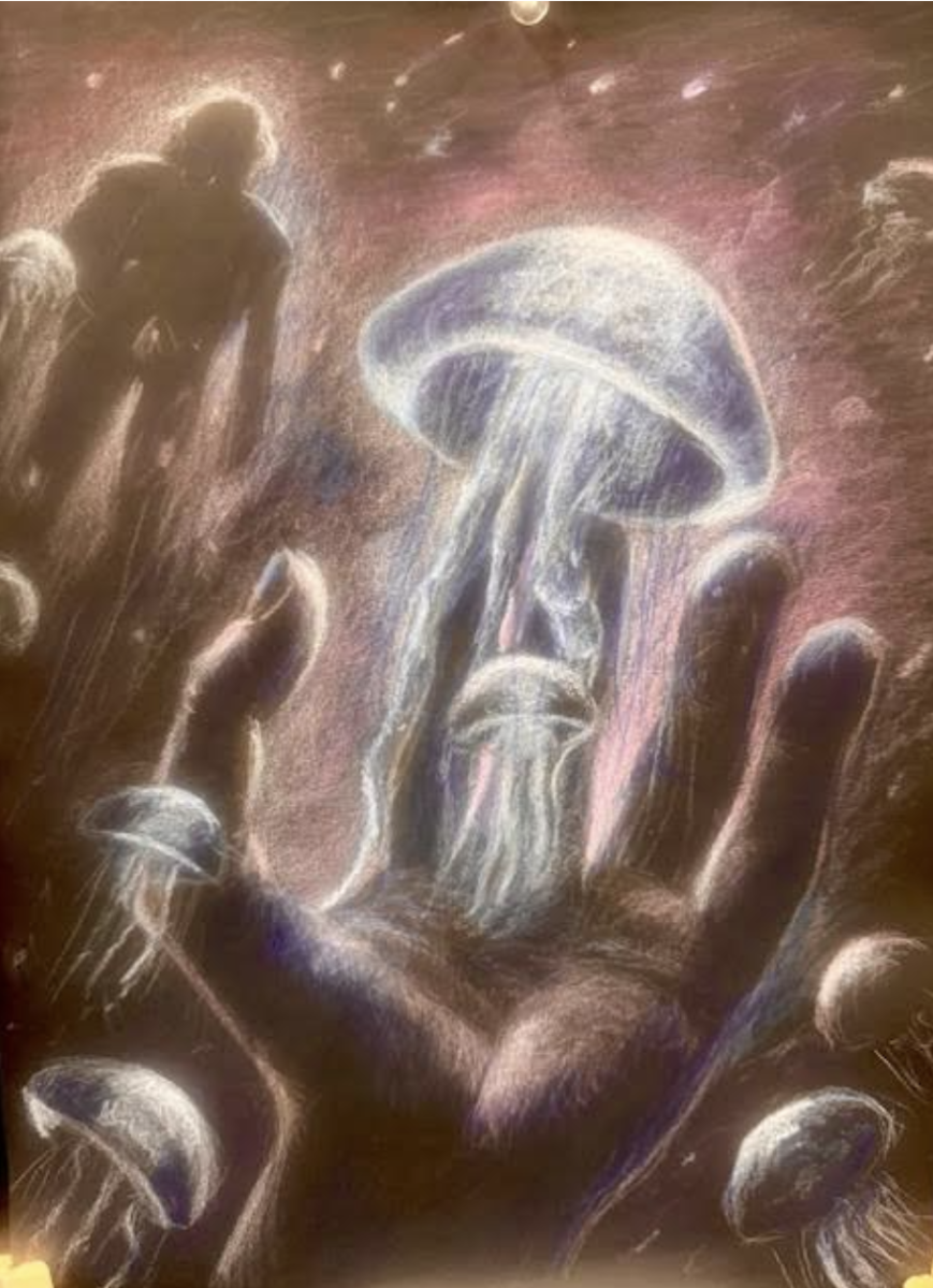 The hand reaching out towards the jellyfish represents individuals' reach for connection even in the most barren of landscapes. Ekaterina Karykina (11) used colored pencils in order to capture the subtleties of the piece — from the flowing tentacles to the gloss of the hand and the sketchy outline of the astronaut — in detail. Photo courtesy of Katie O'Brien.