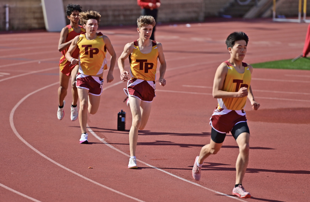 Sam Boyles (11) runs at a track and field meet vs. Mt. Carmel on March 12. Boyles has been unable to compete in his varsity cross country meets due to various injuries. Photo courtesy of Anna Scipione.