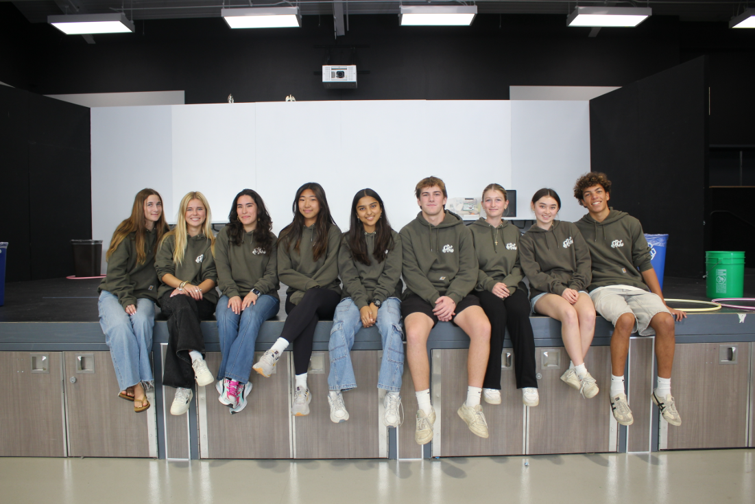 (Left to right) Lily Bruch (12), Tess Wheatley (12), Angelia Coenen (12), Sabine Chung (12), Avani Goyal (10), Jake Selecky (12), Tegan Inns (12), Emiko Matsuda (12) and Dean Smith (12). The Go Greenish officer team smiles for a photo. Students from both Torrey Pines High School and Canyon Crest Academy went to Earl Warren Middle School to host a presentation for the students as part of the Road to Zero Waste program. Photo courtesy of Dean Smith.