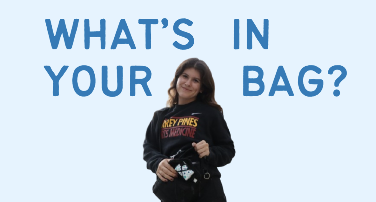 Ava Bauer (12) smiles in her sacred 'sports medicine' creweneck with her med-kit wrapped around her body. Bauer has been in the sports medicine program for three years, now serving as president, and intends to pursue sports medicine as a career. (Viktoria Kiss)