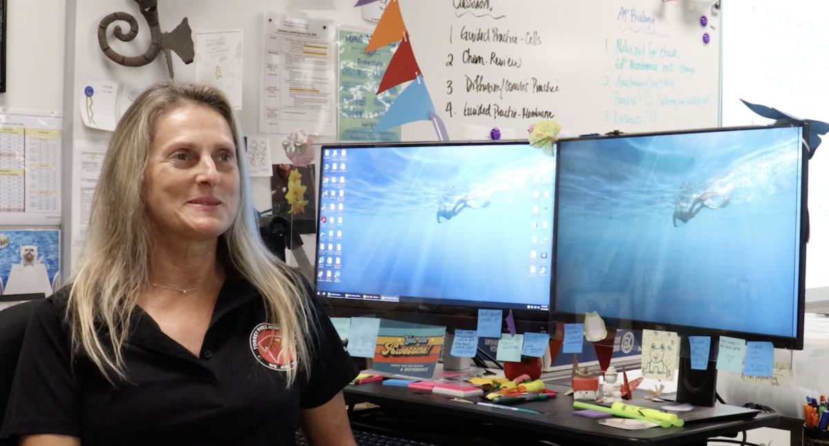 Julianna Newell sits at her desk. Prior to being a biology teacher, she was a biologist in San Diego. Photo courtesy of Tristan Shin.