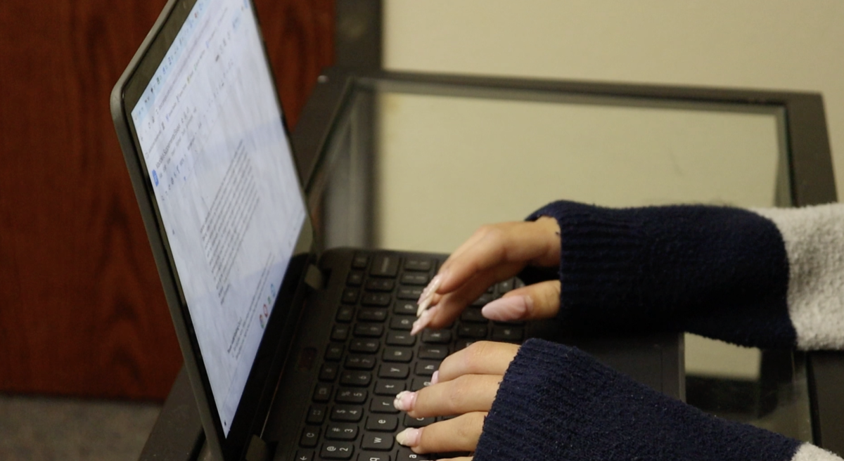 A student types on their computer preparing for college applications. This PSA aired on Friday. Photo courtesy of Chris Kam.