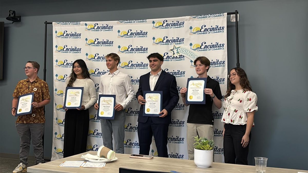 Aaron Nayki (12), fourth from left, holds up his Encinitas Rising Star Award at the award ceremony. Nayki was recognized for his leadership and dedication to the community. Photo courtesy of Aaron Nayki.