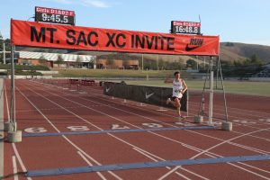 Luka Trevino (10) celebrates his win as he emerges from the Russian Race with a clear lead. Trevino has been apart of the varsity swim and dive, cross country and track and field team since his freshmen year. Photo courtesy of Luka Trevino
