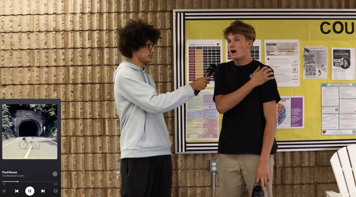 Reporter Sebastian Inguinez quizzes Jason Jutronich (11). This segment aired last week on Falcon Vision. Photo courtesy of Sebastian Inguinez. 