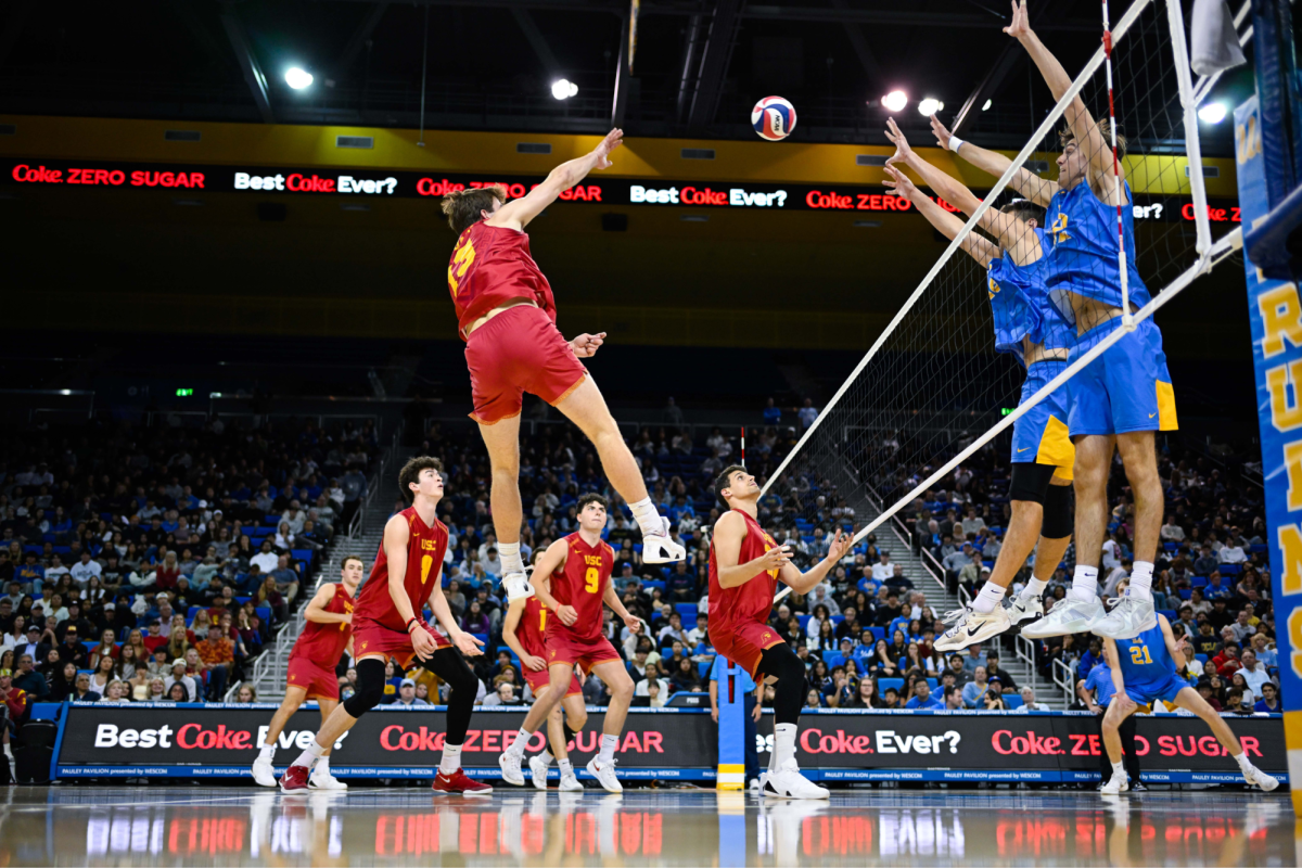 Christian Connell ('24), University of Southern California outside hitter, spikes a ball against the University of California, Los Angeles team during a game. Connell was a starting player on the school's varsity team in his high school career. Photo courtesy of Christian Connell.