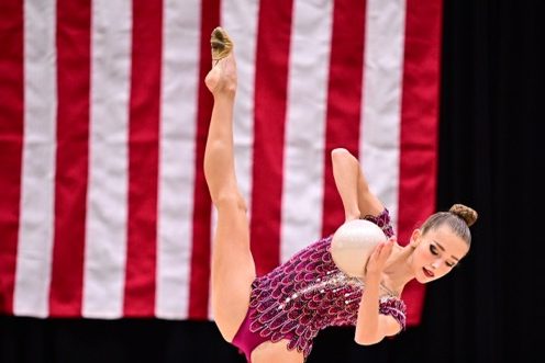 Chloe Daymude holds a ball in standing side split. Her coach, Taura Hall believes that Daymude deserved this award because of her dedication and attitude. Photo courtesy of Chloe Daymude.
