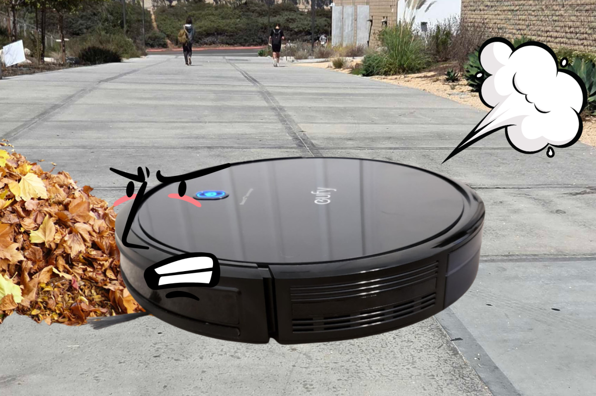 A Roomba gathers fallen leaves in the school parking lot. Thanksgiving break saw strange occurances across campus. 