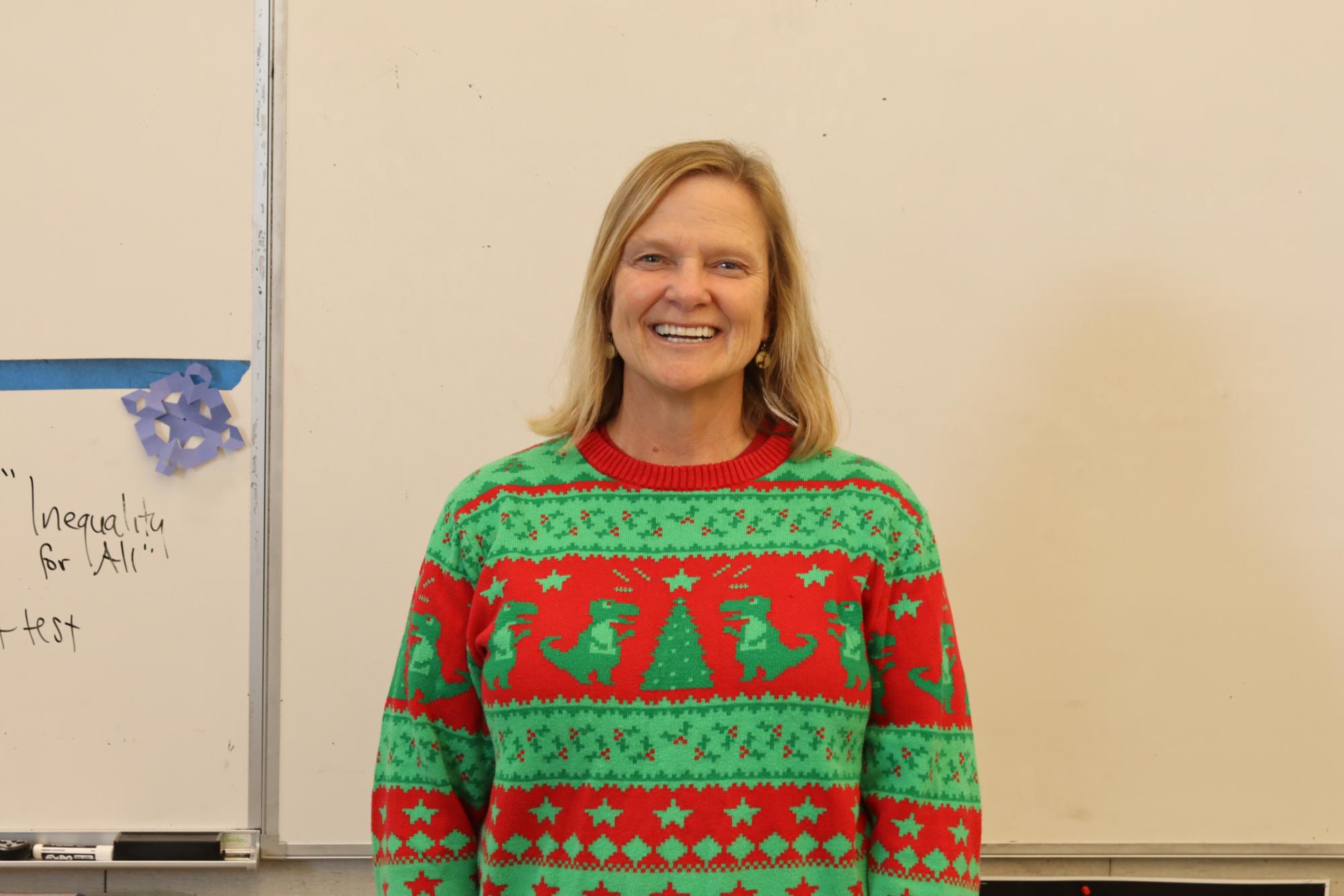 Lisa Callender poses for a photo. For each day of December, Callender wears a Christmas or Hanukkah sweater to celebrate the Holidays. 