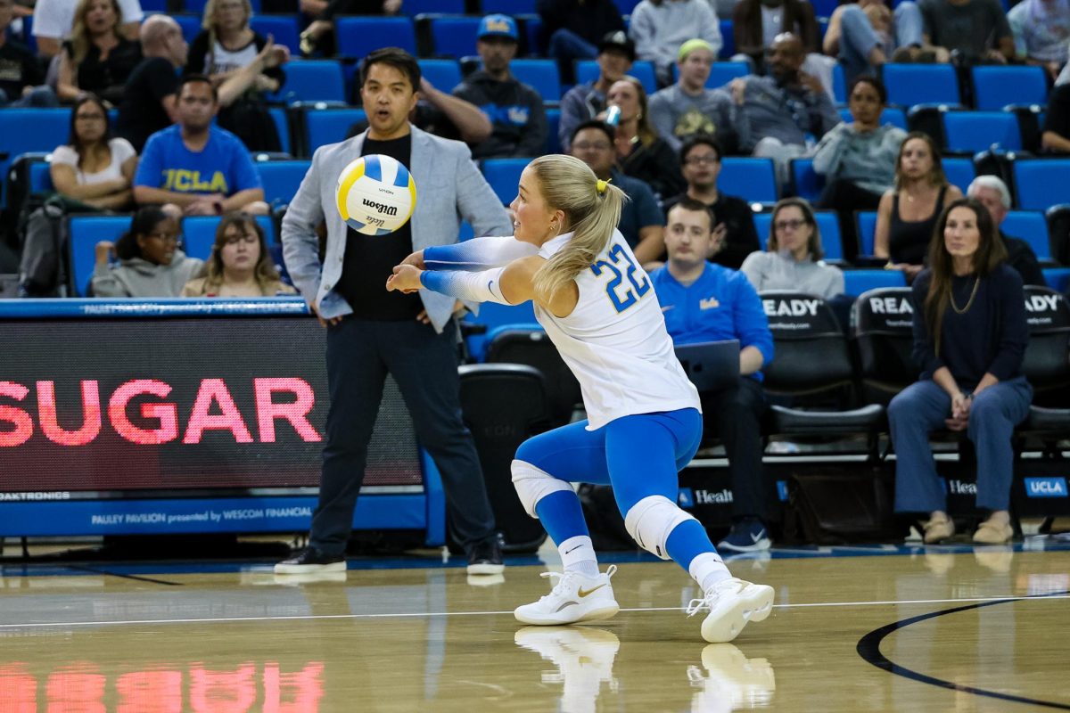 Katerina Lutz ('23) passes an upcoming volleyball at a Division I women's volleyball match. Prior to her career at the University of California, Los Angeles, Lutz was a contributing athlete on the school's varsity volleyball as the starting libero. Photo courtesy of Katerina Lutz.