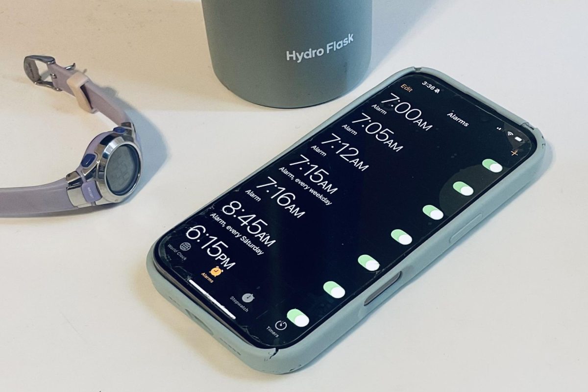 A phone screen shows a number of alarms set for morning. Approximately 20% of high schoolers in California faced chronic absenteeism, or missing more than 10% of school in the 2024-25 school year, according to attendance records.