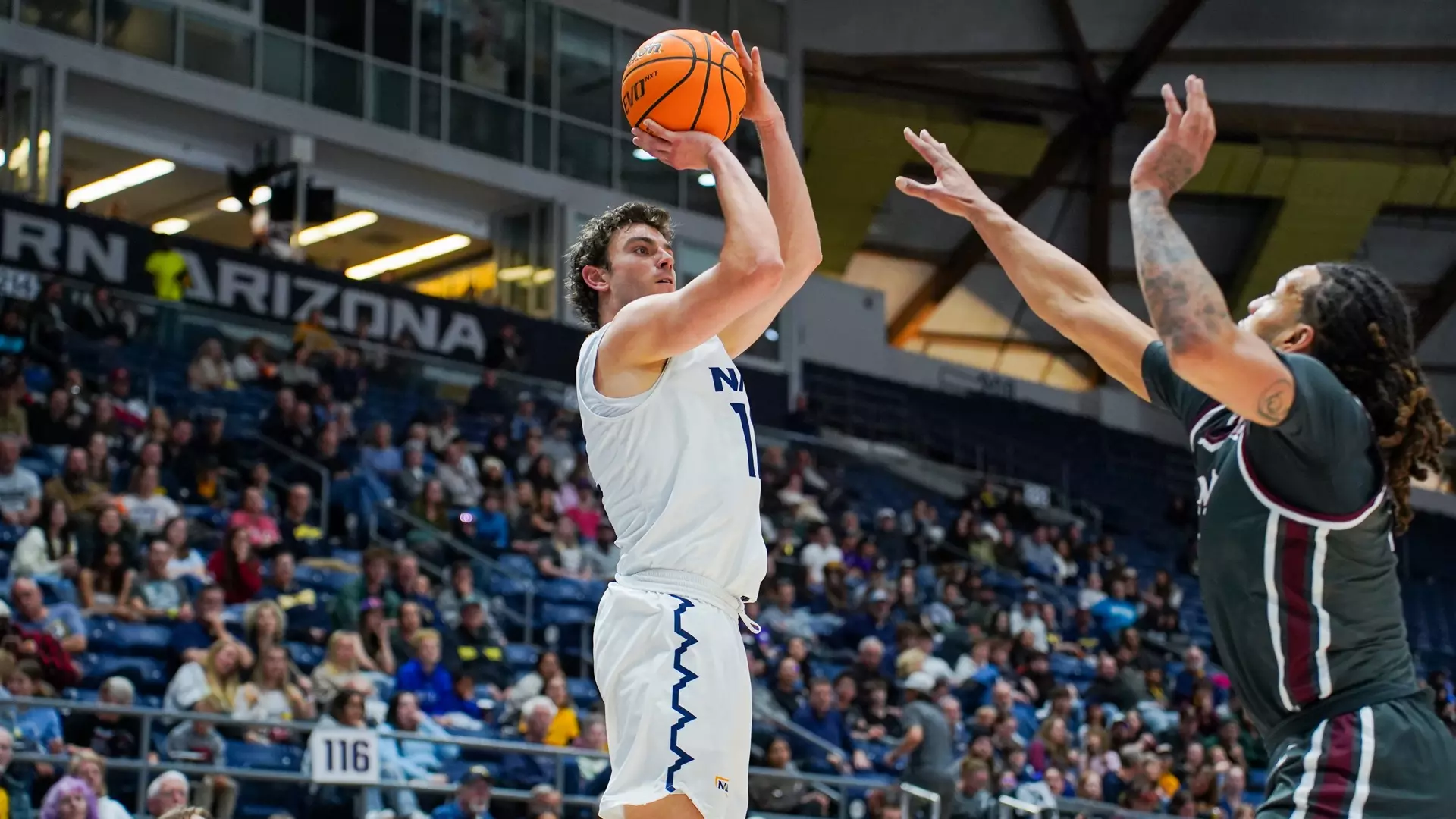 Diego Campianso ('21) makes an attempt to shoot a basket. Campianso was a redshirt player, training with the team without competing, before he was officially recruited. Photo courtesy of NAU Athletics.