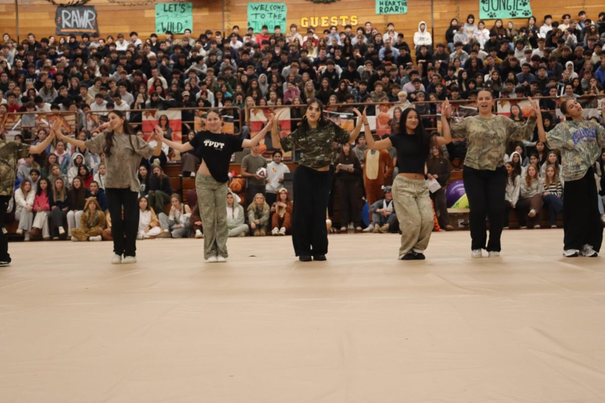 Left to right: Ella Kaplan (12), Shea Faassen (12), Tescia Konkol (11), Alyssa Yeh (12), Caitlyn Van Hoose (12) and Ariana Bertino (12). The varsity small Hip-Hop team performs at the Winter sports pep rally. One of the songs they danced to was “Gnarly” by KATSEYE. 
