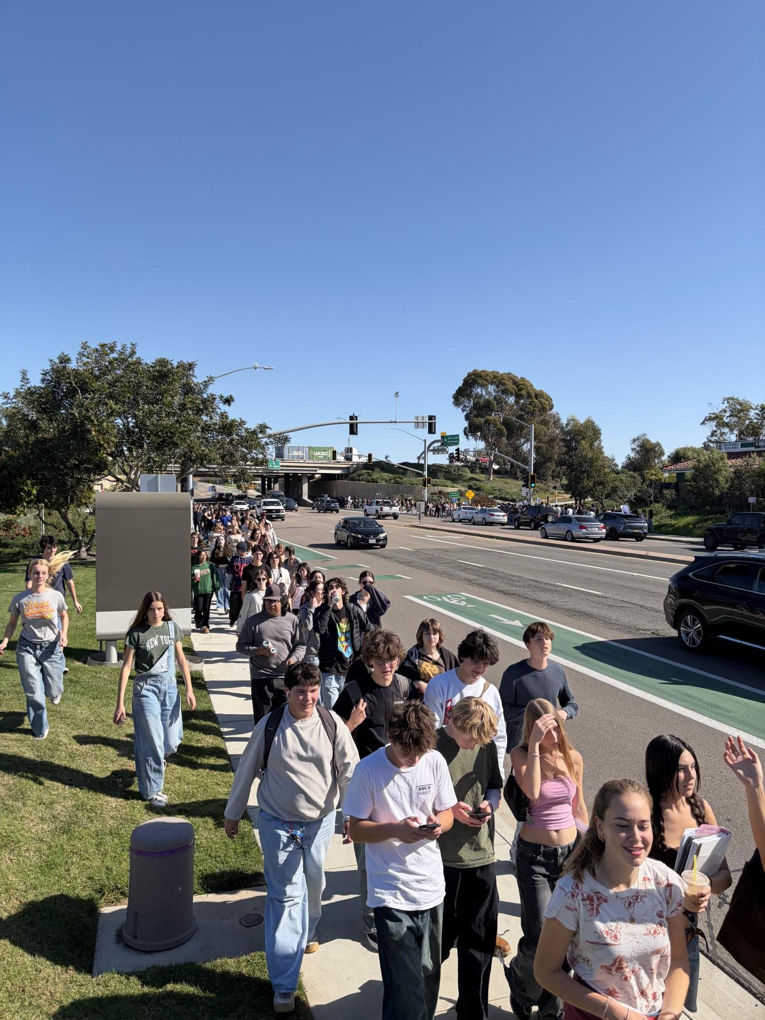 San Dieguito Academy students walk down Santa Fe Drive. The school's Multicultural Antiracism Coalition club organized the protest. Photo courtesy of Riley Patuski.