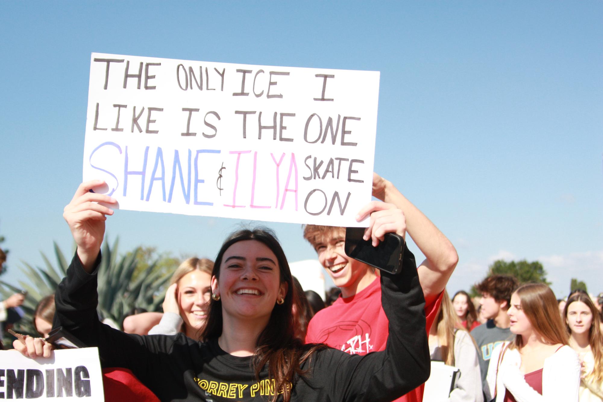 Kyla Crist (11) holds up a sign referencing the television series "Heated Rivalry." She was at the school's walkout on Feb. 6.
