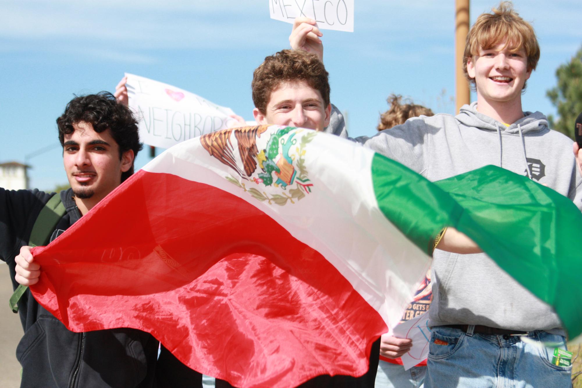 (Left to right) Aydin Rafii (12), Gabriel Turquie (12) and Asher Harron (12) lead hundreds of students of protesters. Turquie's Mexican flag flowed with the wind.