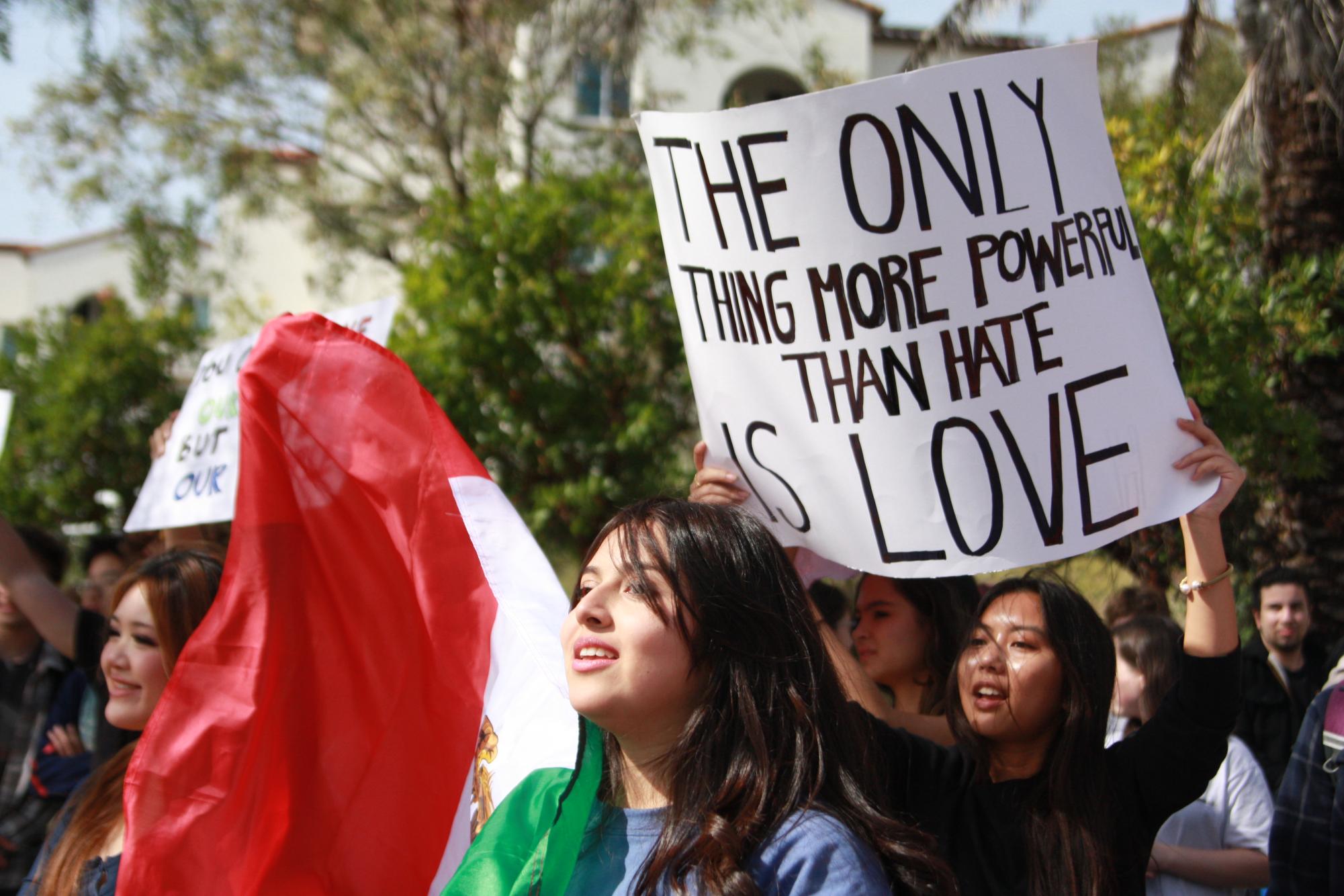 A protestors sign reads "The only thing more powerful than hate is love." Canyon Crest Academy student organizers made their instagram account, @cca.ice.walkout, on Feb. 6.