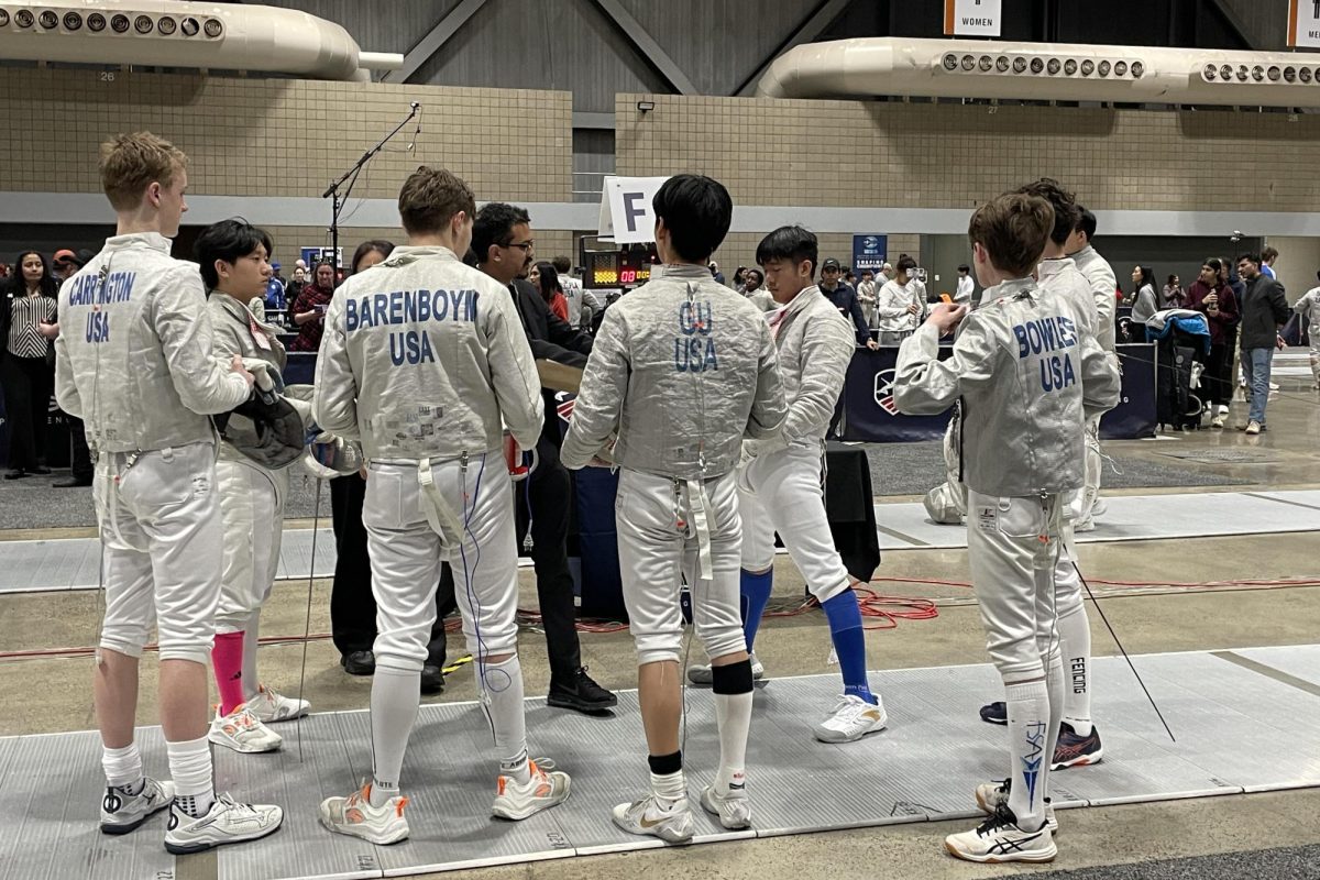 Kevin Gu (11) checks-in with officials before fencing begins — ensuring none of his gear is faulty. He participated in the 2026 Junior Olympics in Kansas City from Jan. 9  to 12. Photo courtesy of Kevin Gu.