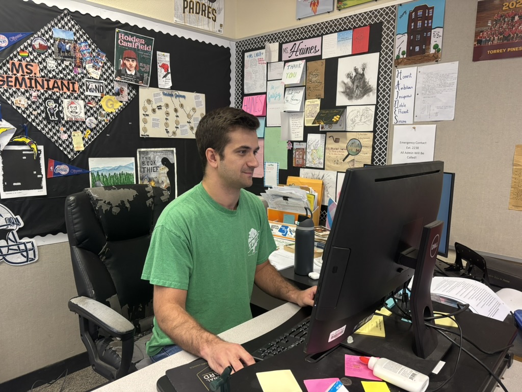 Mason Jessee prepares for his 5th-period statistics class. Jessee graduated from the University of California, San Diego, and then completed the teacher credential program at San Diego State University. (Talia Rosenthal)