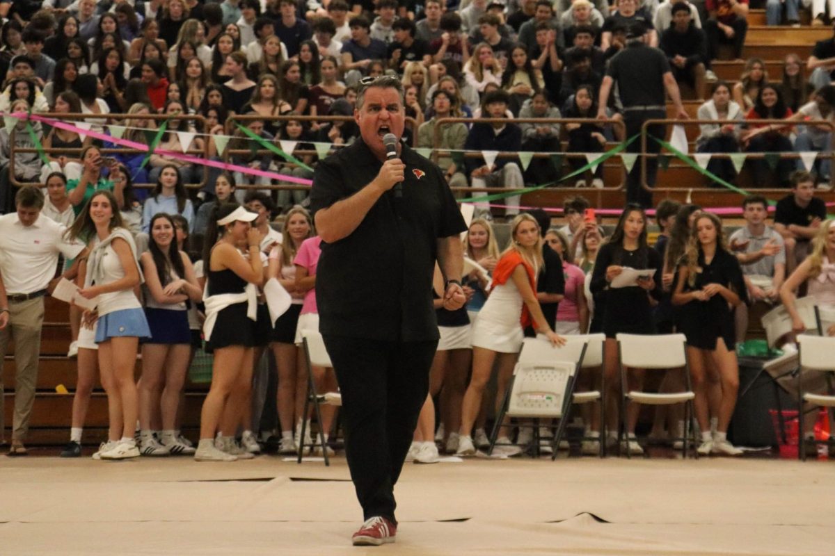 Principal Rob Coppo leads the school chant before the pep rally ends. The pep rally was the second to last pep rally of the year.
