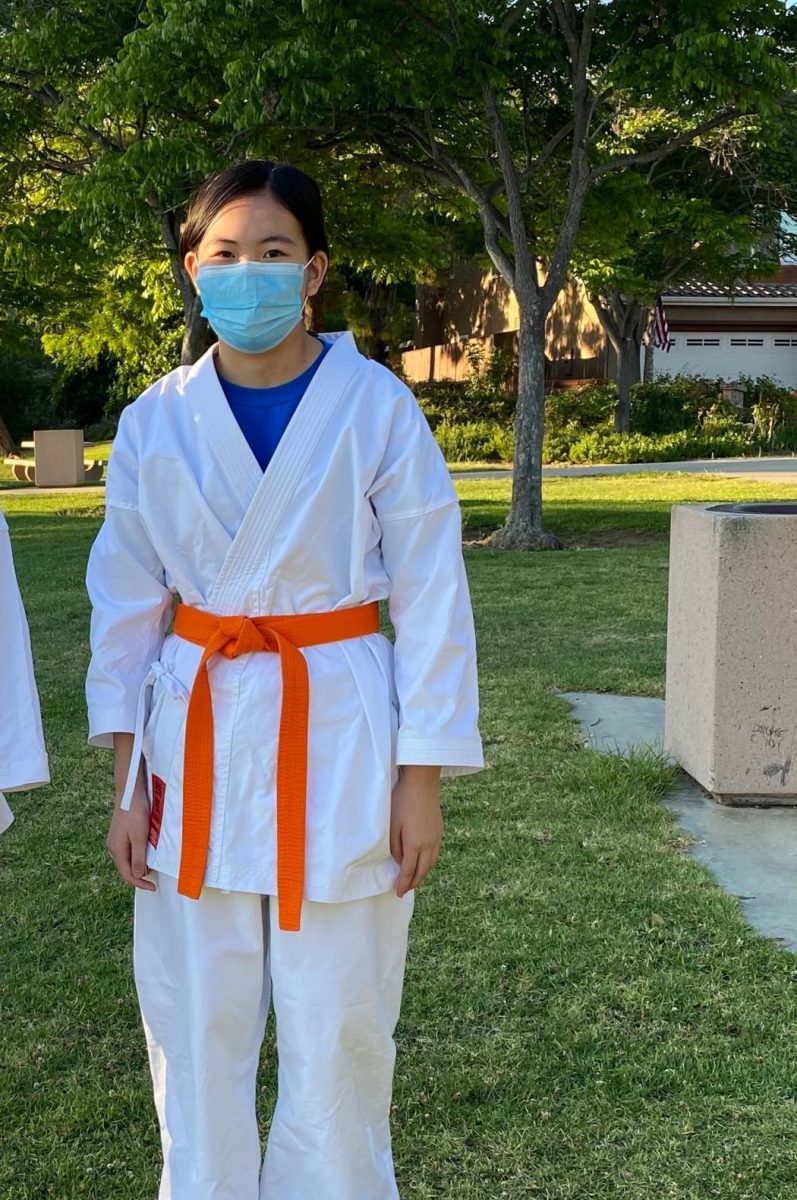 Lucy Huang (12) practiced martial arts during lockdown. She took her belt test outdoors. Photo courtesy of Lucy Huang.