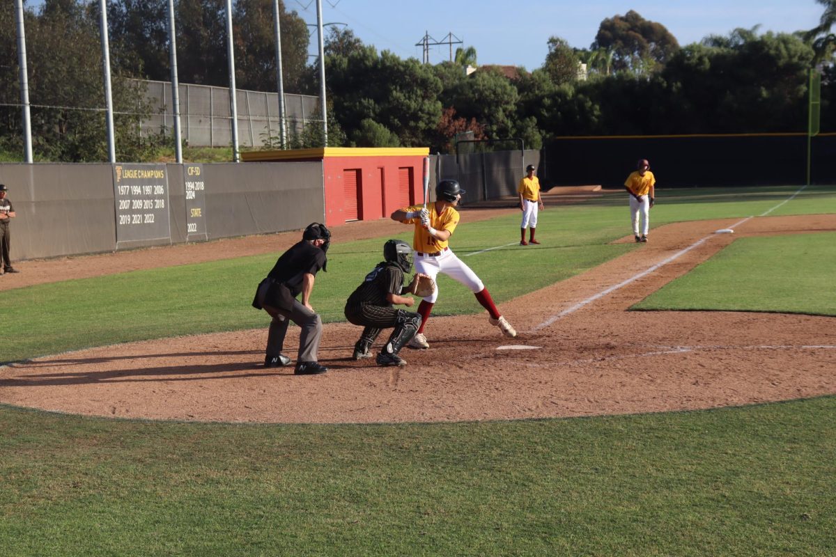 Dylan Hood (9) gets ready to hit a pitch. As a freshman, Hood was called up to the varsity team.