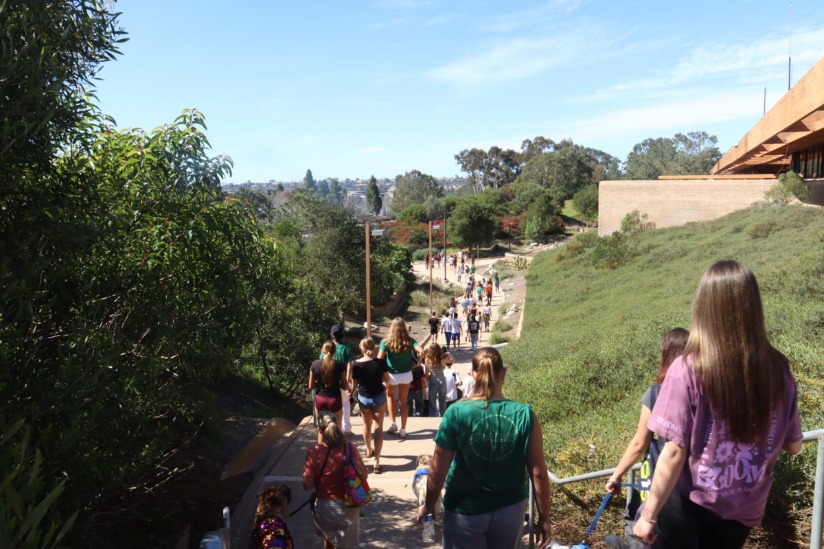 Falcons exit campus in the final stretch of the walk. The walk trailed along the perimeter of the school, stopping when they reached tables where PALs informed them about different types of eating disorders.