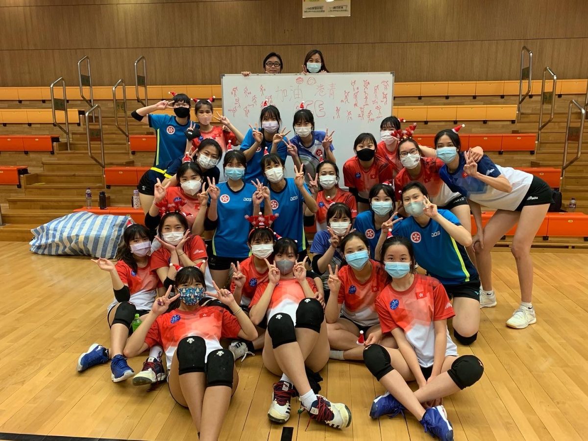 SzeNga (Sarah) Tsang poses with her club team in Hong Kong. Tsang has had experience coaching athletes internationally. Photo courtesy of SzeNga Tsang.