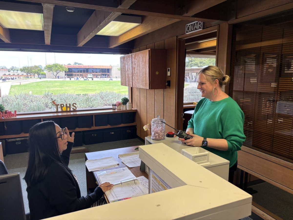 Left to right: Tamara Rey and Kelly Gilbert. Rey and Gilbert talk about the view of the Ed Burke Field. Gilbert has previously been on campus and plans on coming more as the year ends to get more familiarized.