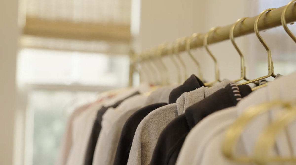 Clothes hang on a rack ready to be customized. Daisy Days started as a passion project. Photo courtesy of Cade Barber. 
