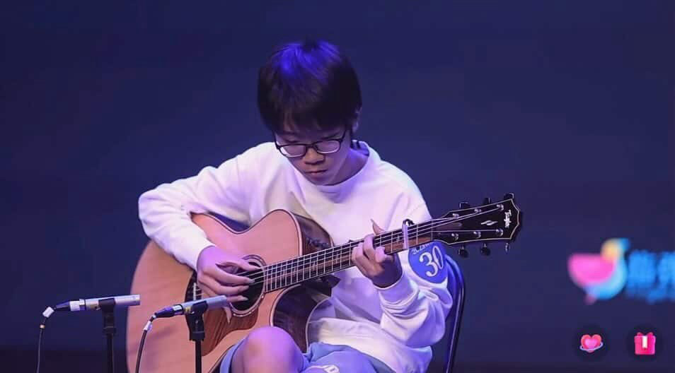 Steven Xu (11) plays the guitar fingerstyle. Xu began his music journey with the ukulele around the age of eight. Photo courtesy of Steven Xu.