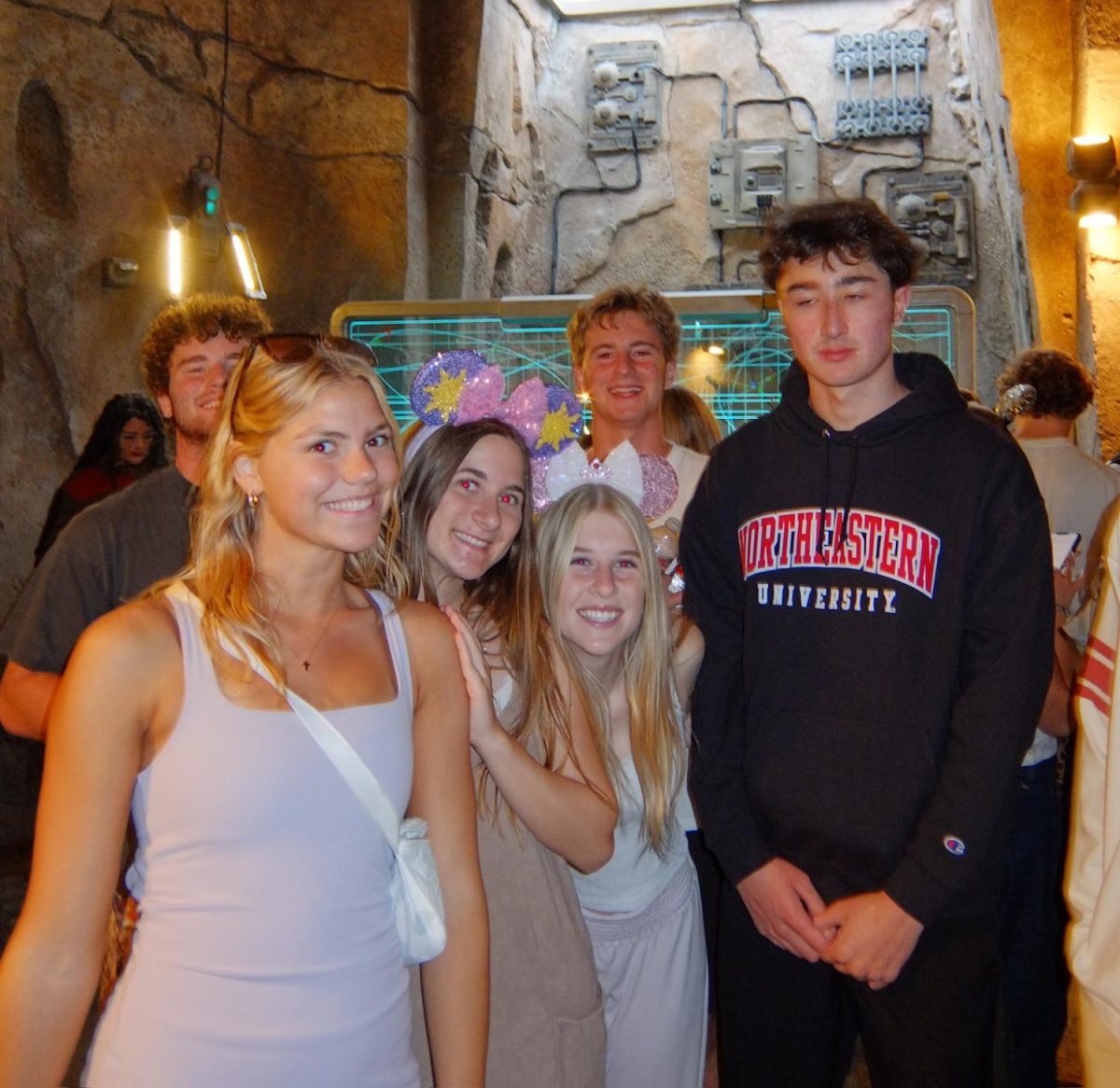 (Left to right) Andrew Taich (12), Greta Rucks (12), Lily Bruch (12), Kiki Hoglen (12), James Halpern (12) and David Kim (12) wait in a line. The picture was taken in Star Wars: Galaxy's Edge. 
