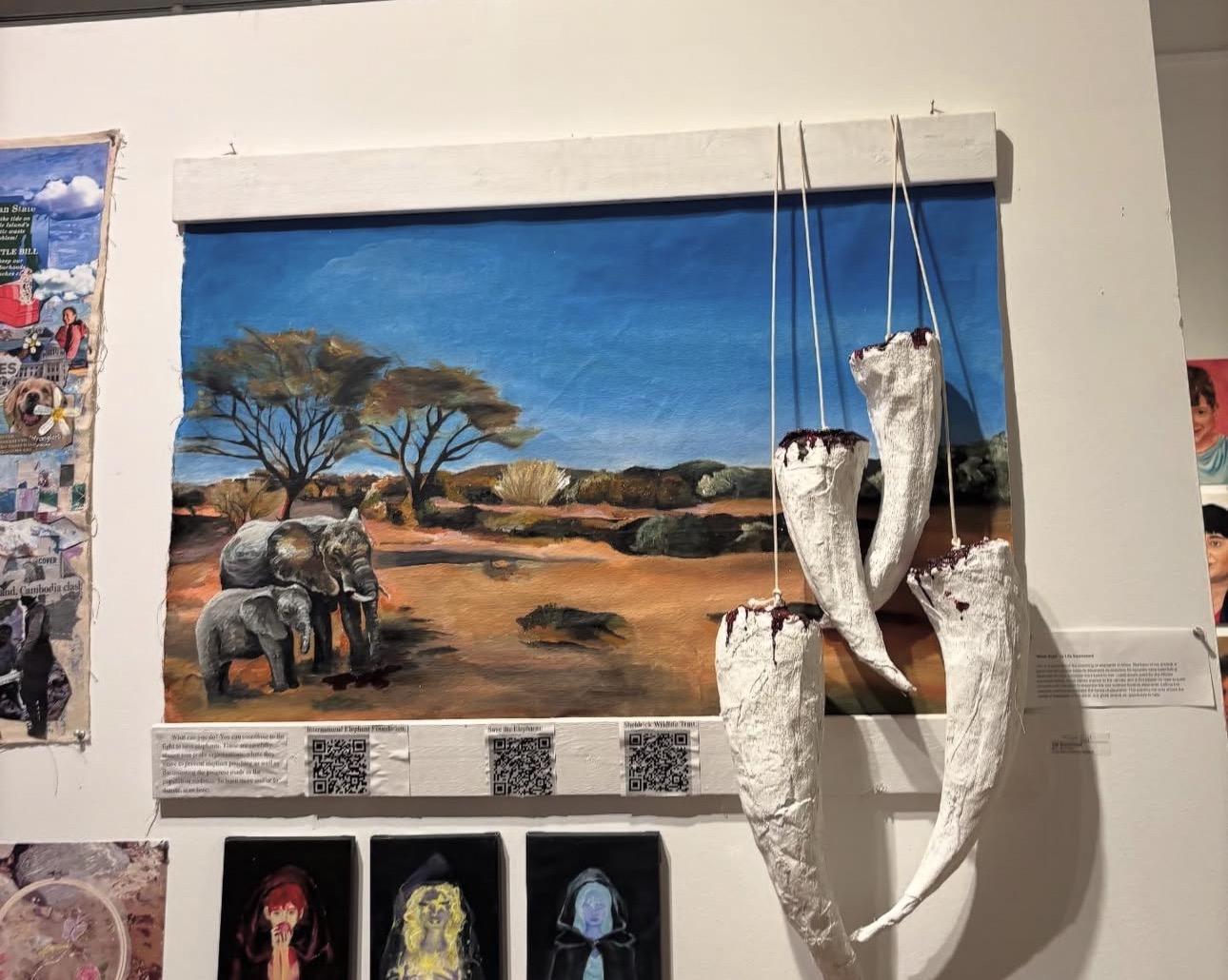 Makeshift paper mache elephant tusks hang from the top of an art piece. Lila Swortwood (11) presented her creation at the Rhode Island School of Design Pre-college Summer Program's art exhibit. Photo courtesy of Lila Swortwood.
