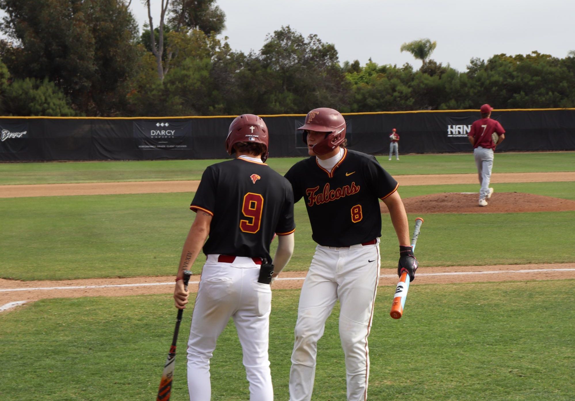 Camden Nishnick (11) celebrates with his teammate after scoring a run. He won Athlete of the Month for April.