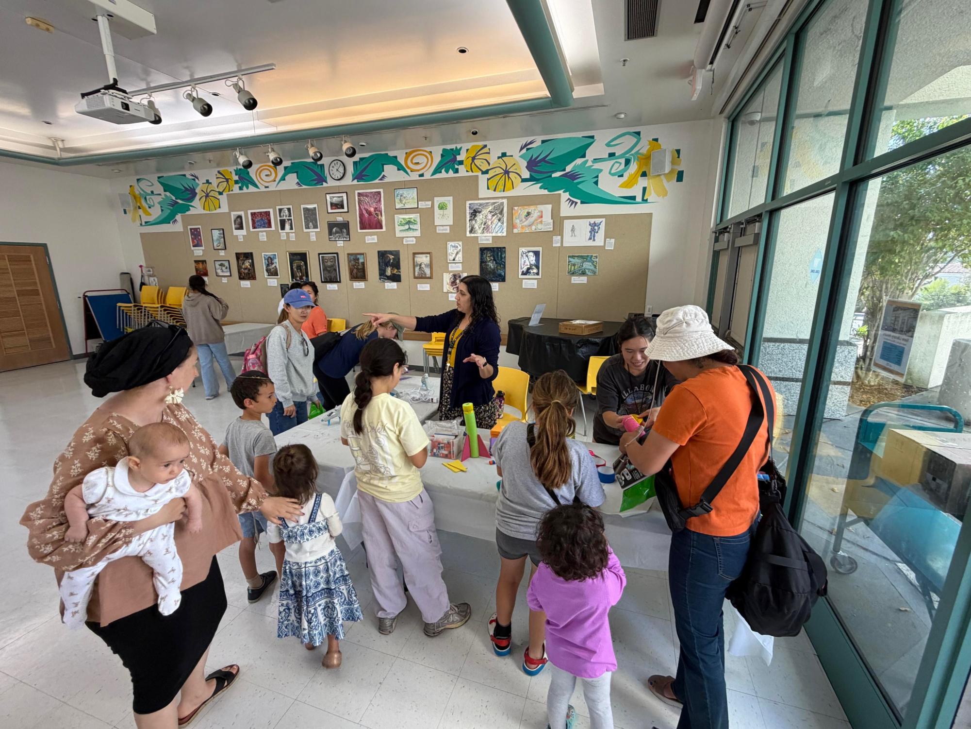 Kids take part in activities at the Space Day event. The library hosted Space Day on April 29, organizing crafts such as pool noodle rockets and lace-up constellations. Photo courtesy of Baylin Tsai.